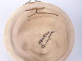 an image of a bowl with writing on it sitting on a white surface