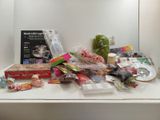 a white counter top with a bunch of items on it