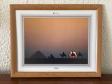 an image of a picture of three people riding camels in the desert