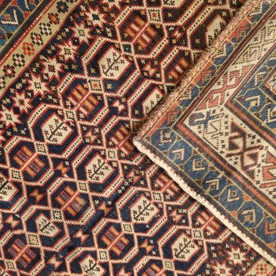 a close up of a rug with different colors and patterns