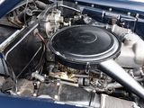 a close up of a car ' s engine with the hood up