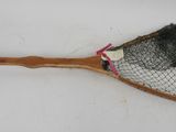 a tennis racket with a net attached to it