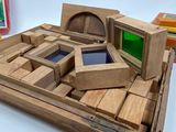 a wooden model of a computer with a green screen