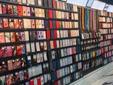 a wall of cell phones on display in a store