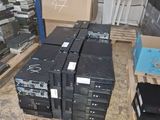 many boxes of electronic equipment on the floor in the room