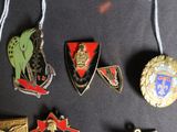 a lot of badges that are hanging on a wall