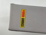 a person holding up a box with a sticker on it