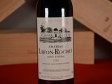 a bottle of wine that is sitting on a table