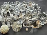 a pile of glass objects on a black surface