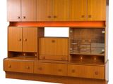 an image of a wooden cabinet with drawers and drawers