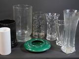 a lot of glass vases that are sitting on a table