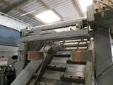 an image of a machine that is working on a piece of metal