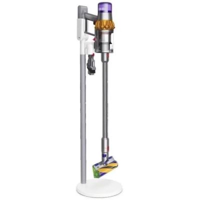 a close up of a vacuum cleaner on a stand on a white surface