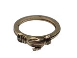 a close up of a gold ring with a heart on it