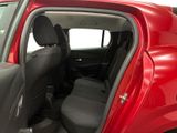 a red car with the door open and the seats down