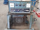 a machine that is sitting on a pallet in a warehouse