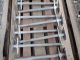 a pile of screws and bolts on a pallet in a warehouse