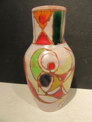 a white vase with a multicolored design on it