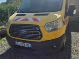 a yellow van that is parked on the side of the road