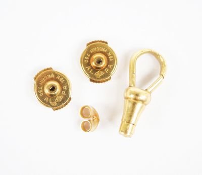 three pieces of gold colored metal with a hook and a pair of screws