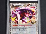 a close up of a card in a plastic case on a table