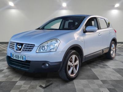 the silver nissan rav is parked on a checkered tile floor