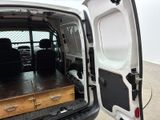 a white van with its doors open in a parking lot