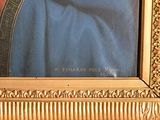a painting of a man in a blue robe with a gold frame