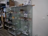 a glass display case with a lot of items in it