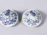 pair of blue and white dishes with blue flowers on them
