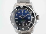 rolex submarine watch with blue dial and black bezel