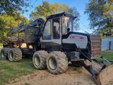 a large tractor that is parked in the grass
