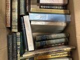 a box full of books that are sitting on a table