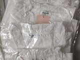 six pairs of white underwear wrapped in plastic