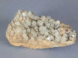 a rock with a lot of white crystals on it