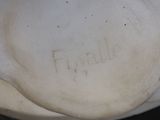 a close up of a white vase with writing on it