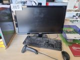 a computer monitor, keyboard, mouse and mouse on a desk