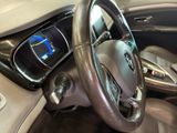 a steering wheel and dashboard of a car in a showroom