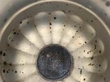 a close up view of a blender with a lot of dirt on it