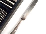 a silverware set with a knife and fork in a box