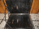 an image of a grill that has been burnt out