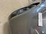 a close up of a car ' s front bumper with a sticker on it