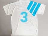 a white shirt with a blue and white number 3 on it