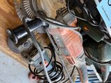 a pile of tools sitting on the floor next to a box