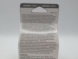 a close up of a box of toothpaste on a white surface