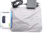 a box with a mouse and a charger on it