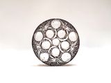 an image of a silver ring with white stones on a white background