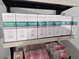 many boxes of soaps on a shelf in a store