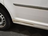 a picture of a white car with a flat tire