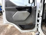 a door of a truck with the driver ' s side door open